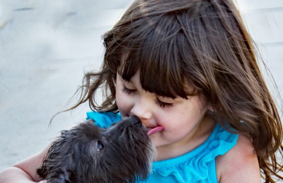 dog kissing little girl blog leo luckys