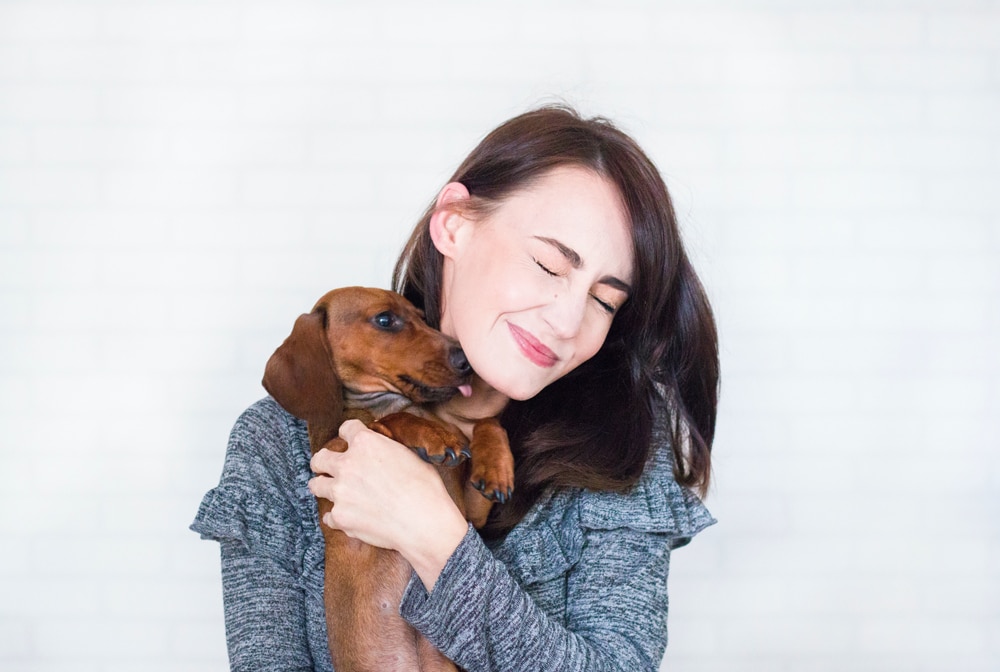 dog kissing woman